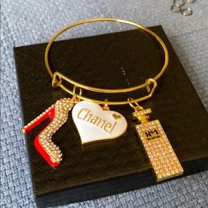 Gold plated bangle with charms